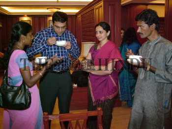 CHENNAI: Viswanathan Anand and his wife Aruna, interacting with the Aids  patients at GRT