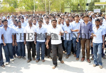 Employees of KPR Mill at Perundurai SIPCOT Industrial Estate, that was  closed a month