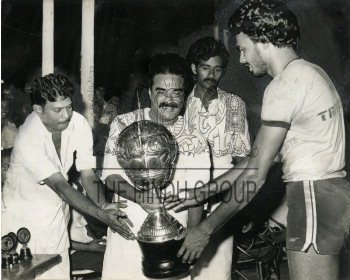 Cyril C. Valloor of Southern Railway receiving the trophy from the Finance  Minister of Kerala,... | The Hindu Images